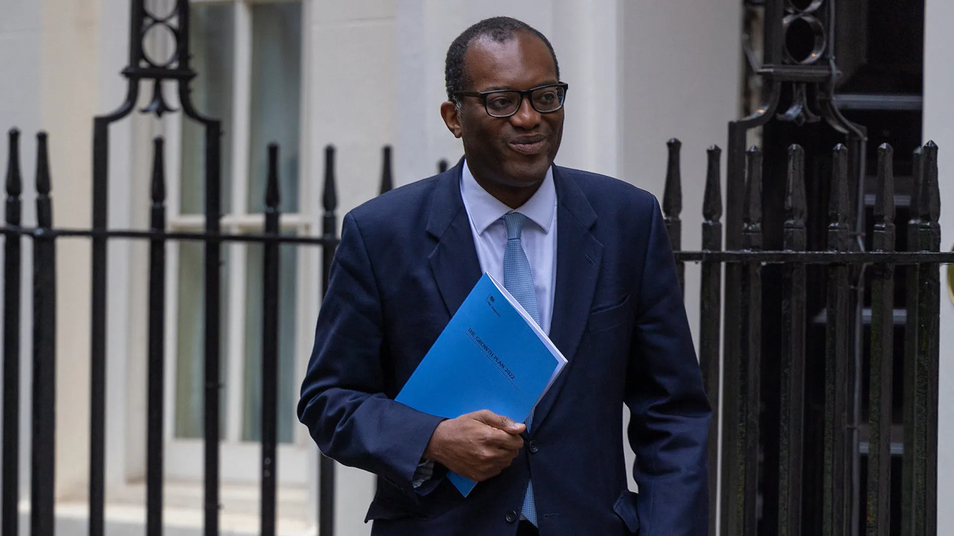 Kemi Badenoch holding the blue book