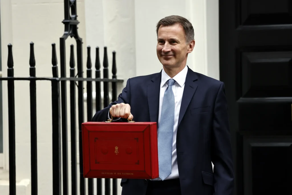 Jeremy hunt holding the red briefcase