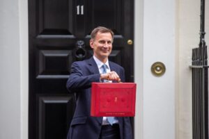 Jeremy hunt holding the red briefcase