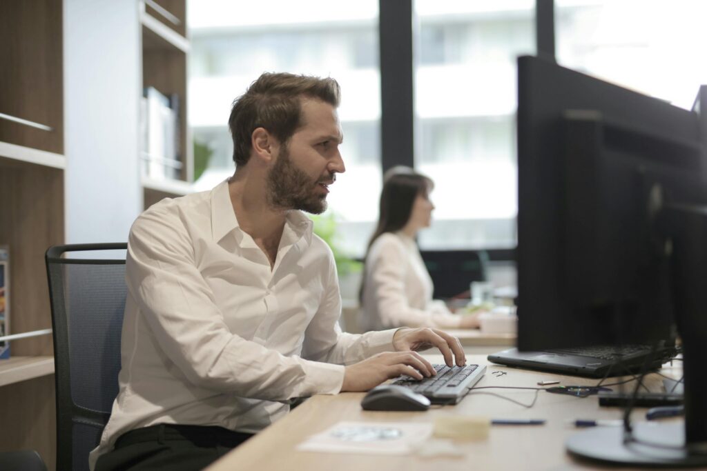 Man and woman working at their desk in the office
